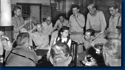 Iva Toguri interviewed by reporters at the Bund Hotel in Tokyo in 1945